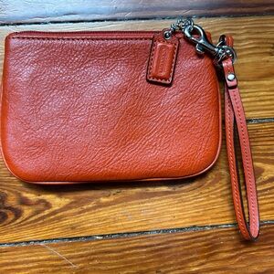 Burnt Orange Coach Wristlet